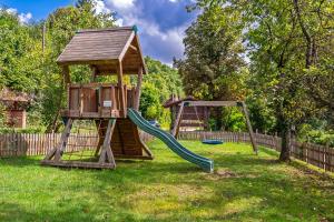 a playground with a slide and a gazebo at Hotel Restaurant St. Germanshof in Bobenthal