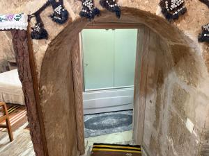 an archway in a room with a window at Karballa Hotel in Aksaray