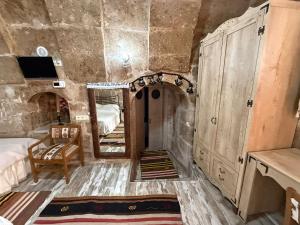 a room with a bed and a mirror in it at Karballa Hotel in Aksaray