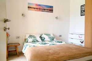 a bedroom with a bed with two pillows on it at Apartman Darija 3 in Gornji Orahovac