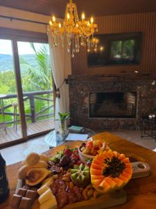a plate of food on a table in a room at Cabana Valle Pietra in Nova Petrópolis