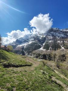 a view of a mountain with snow on it at beheney Homestay gondhla in Kyelang