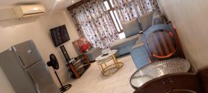 a living room with a couch and a table at Heaven place -1 bedroom beachfront unit in Ukunda