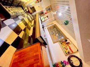 an overhead view of a room with a staircase and a table at O Ansah Plaza Lodge in Kumasi