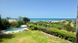 a view of a swimming pool and the ocean at Dunas - Private Pool - 8 Guests - Albufeira in Albufeira