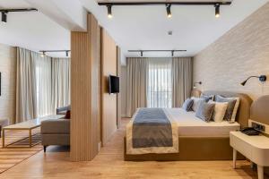 a hotel room with a large bed and a couch at Espina Hotel in Antalya +63 photos