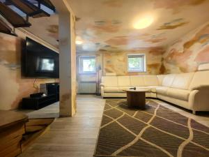 a living room with a couch and a table at Villa Mario Verde in Punat