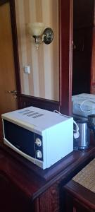 a toaster oven sitting on top of a table at Viešbučio stiliaus butukas centre in Palanga