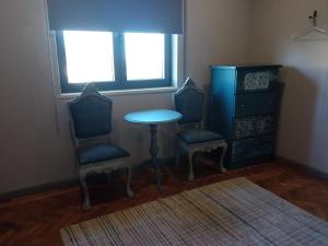 a room with two chairs and a table and a window at Meda`s House in Meda