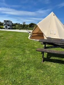 a tent sitting on top of a picnic table at Cornwalls Glamping Tent in Delabole