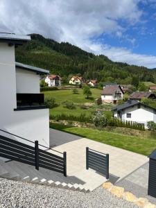 a building with a bench in front of a house at Alpine Loft in Kapfenberg