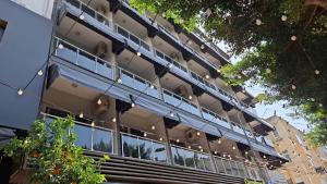 an external view of a building with a balcony at Giray Butik Hotel in Alanya