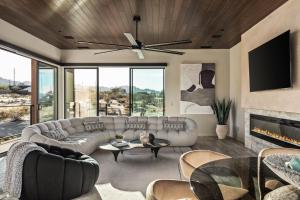 a living room with a couch and a fireplace at Suncrest by Fieldtrip - JT Modern w Pool and Views in Joshua Tree