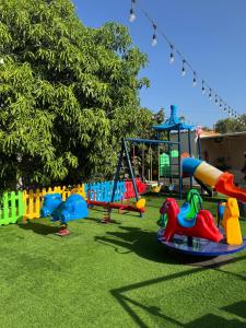 a playground with many different types of play equipment at استراحة الصقر in Khor Fakkan