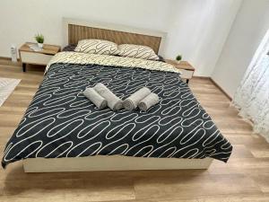 a bedroom with a bed with two pillows on it at KA Home in Petrich +1 photo
