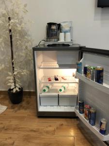 an empty refrigerator with its door open in a kitchen at Cairo City Inn Hotel in Cairo