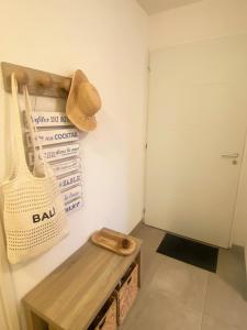 a room with a wooden bench and a door at Villa Léonie in Bonifacio