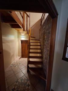 a staircase in a room with a brick wall at De Windmolen in Centurion +18 photos