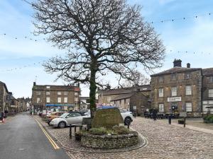 a tree on the side of a city street at Pletts Barn in Grassington +20 photos