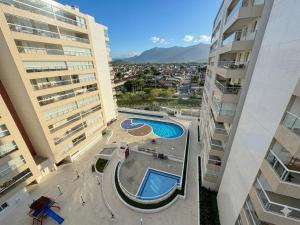 an overhead view of a pool in between two buildings at San Martin in Bertioga