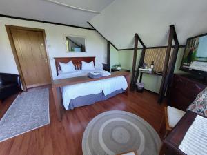 a large bedroom with a bed and a television at Cronin's Guesthouse Bed & Breakfast in Heinola