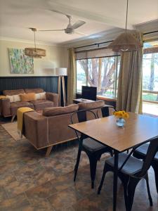 a living room with a couch and a table at Augusta Sheoak Chalets in Augusta