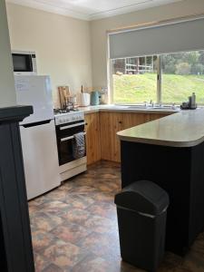 a kitchen with white appliances and a counter top at Augusta Sheoak Chalets in Augusta