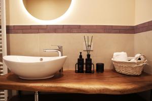 a bathroom with a sink on a wooden table at Agriturismo Ca' Brusca in Due Maestà +12 photos
