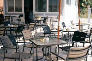 a group of tables and chairs in a patio at Lux Ariana in Donji Štoj