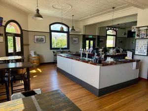 a bar in a restaurant with a counter and tables at Abermain Hotel in Abermain