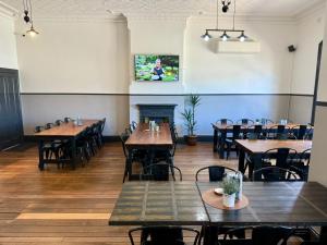 a dining room with wooden tables and chairs at Abermain Hotel in Abermain +34 photos
