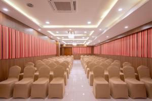 an empty auditorium with chairs and red curtains at Zone Connect by The Park Katra in Katra
