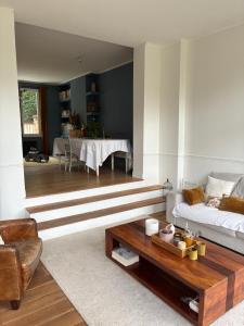 a living room with a couch and a coffee table at Grande maison familiale rénovée en 2025 in Versailles