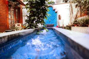 a swimming pool in the middle of a house at Henna Hotel Istanbul in Istanbul