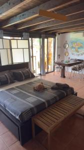 a large bed with a dog laying on top of it at Loft Tortuga in Tinajo +30 photos