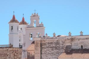 an old building with turrets and a clock tower at Me Gusta Sucre Inn in Sucre