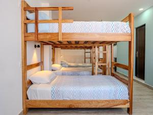 a bedroom with two bunk beds in a room at Me Gusta Sucre Inn in Sucre