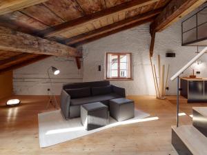 a living room with a couch and a table at berge I Design-Quartiere in Aschau im Chiemgau