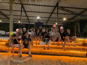a group of people posing for a picture on a stage at Laughing Leopard Sigiriya in Sigiriya