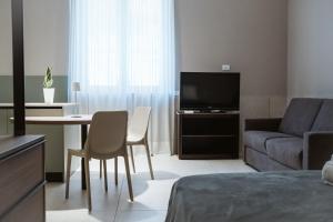 a living room with a couch and a table at MEANDRI Apartment in San Severo +6 photos