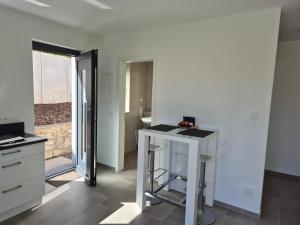 a white kitchen with a counter and a sink at Studio in Wincheringen in Wincheringen +11 photos