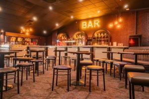 a row of stools in a restaurant with a bar at The Colorado van in Rhyl