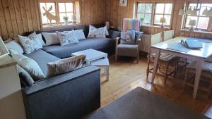 a living room with a couch and a table at Det lilla huset in Nora