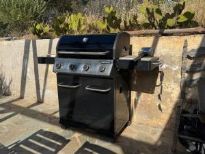 a barbecue grill with a grill at SEA BREEZE STUDIO in Loutraki