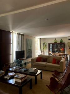 a living room with a couch and a coffee table at Casal do Arcebispado in Felgueiras