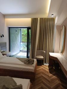 a hotel room with two beds and a mirror at Heaven resort hotel in ToÄŸanalÄ± +20 photos