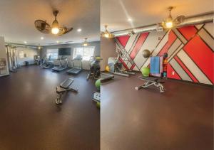 a gym with treadmills and exercise equipment in a room at Olive Oasis in Des Moines