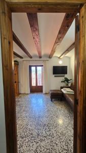 a large living room with a couch and a television at Albergue La Cuba in La Cuba