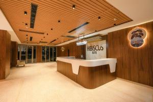 a lobby with a reception desk in a building at Hibiscus Elite Hotel in Greater Noida