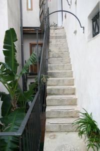 a staircase leading up to a building with plants at Il Cortiletto in Trapani